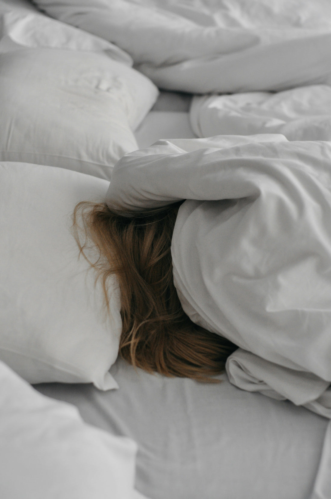 Woman sleeping using mattress cooling pad less dry skin and throat